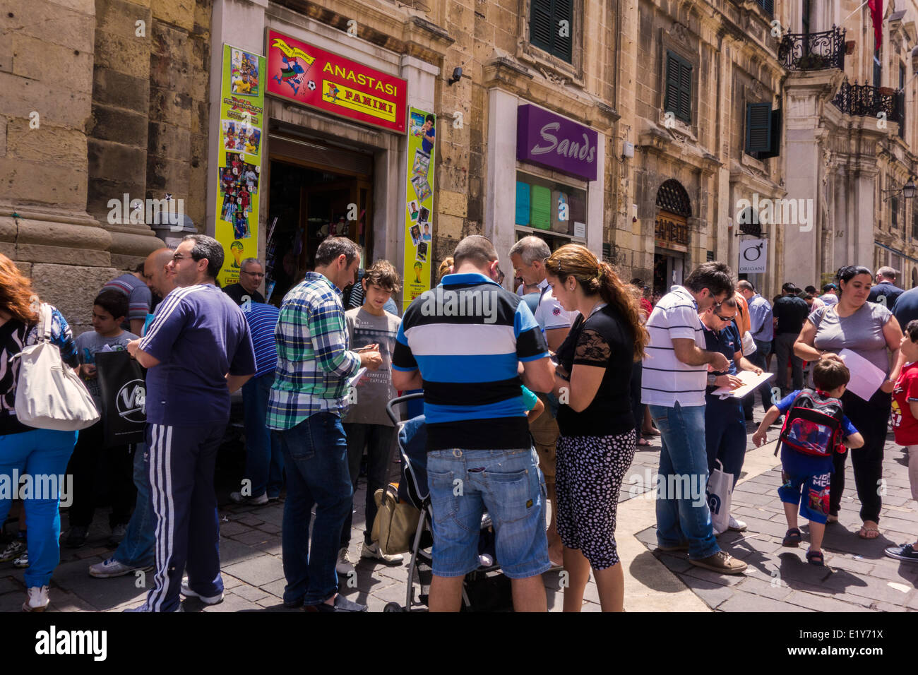 Saturday morning outside a Panini shop. Children and people. Stock Photo