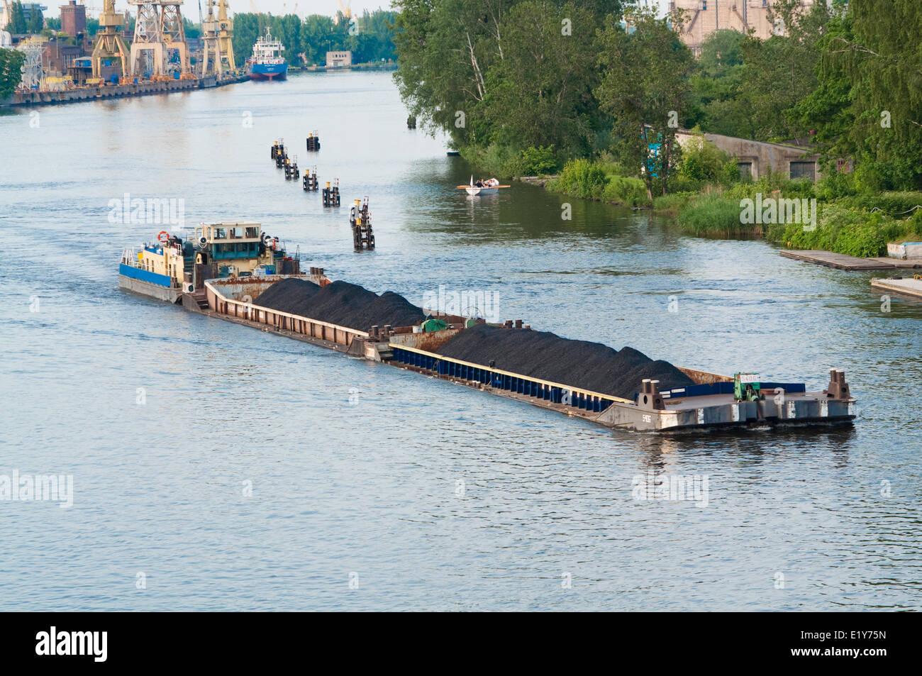 coal barge sailing on the river Stock Photo