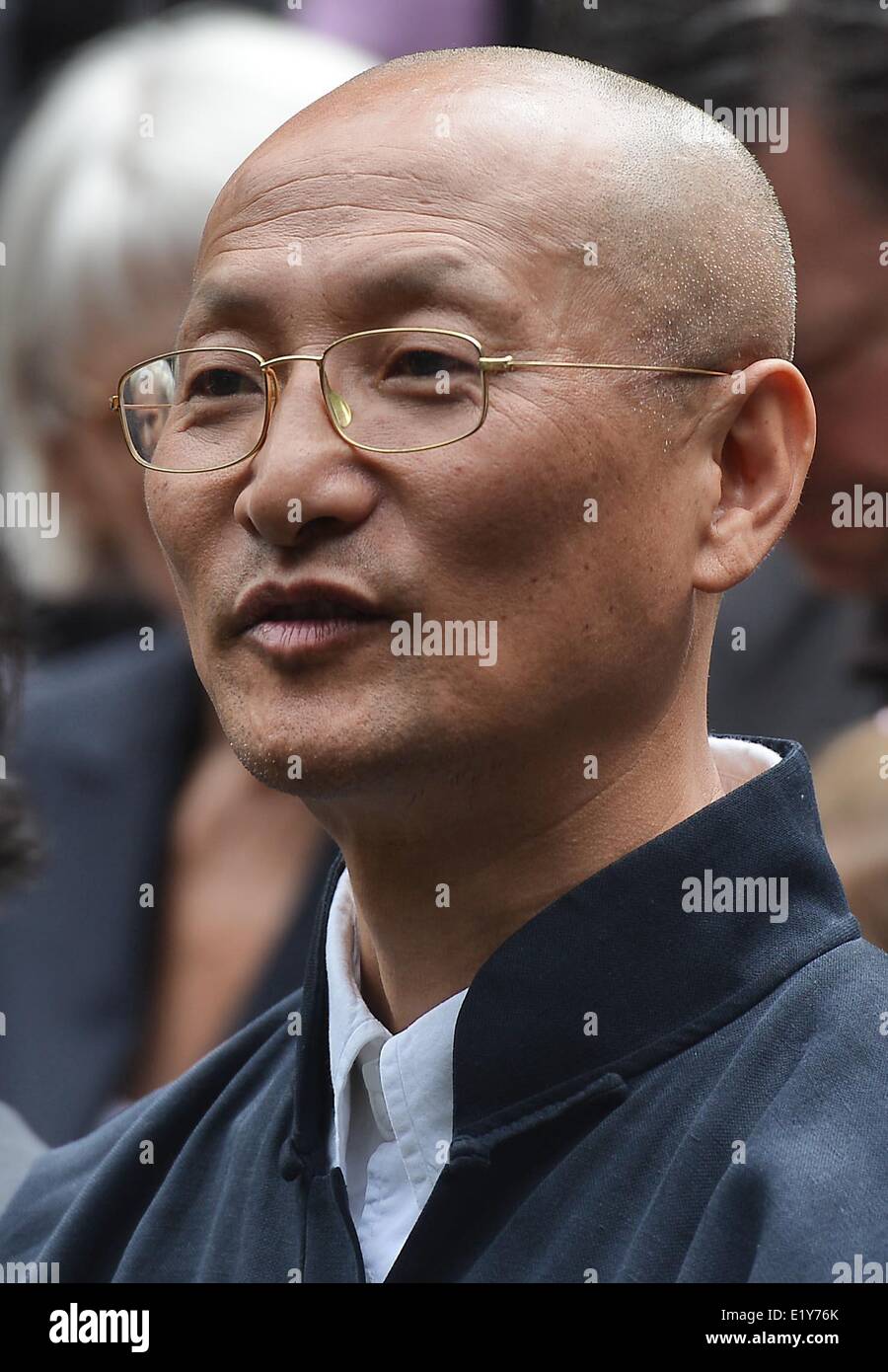 Wuppertal, Germany. 11th June, 2014. Artist Zeng Chenggang takes part in the unveiling of the monument of the philosopher and social theorist Friedrich Engels (1820-1895) donated by the People's Republic of China in Wuppertal, Germany, 11 June 2014. The nearly four-meter bronze sculpture commemorates the co-founder of Marxism, who was born in Wuppertal. Credit:  dpa picture alliance/Alamy Live News Stock Photo