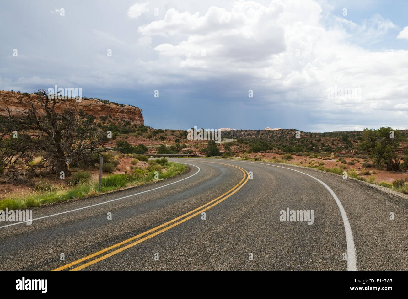 Curving road through the desert Stock Photo