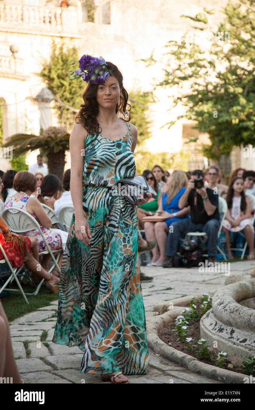 Attard, Malta. 10th June, 2014. The pink fashion show collection including Tommy Hilfiger, GUESS, NEW LOOK, NADINE, OYSHO, FURLA, ESPRIT, in Villa Bologna, Attard in Malta, organised by Times of Malta. Credit:  Amanda Hsu/Alamy Live News Stock Photo