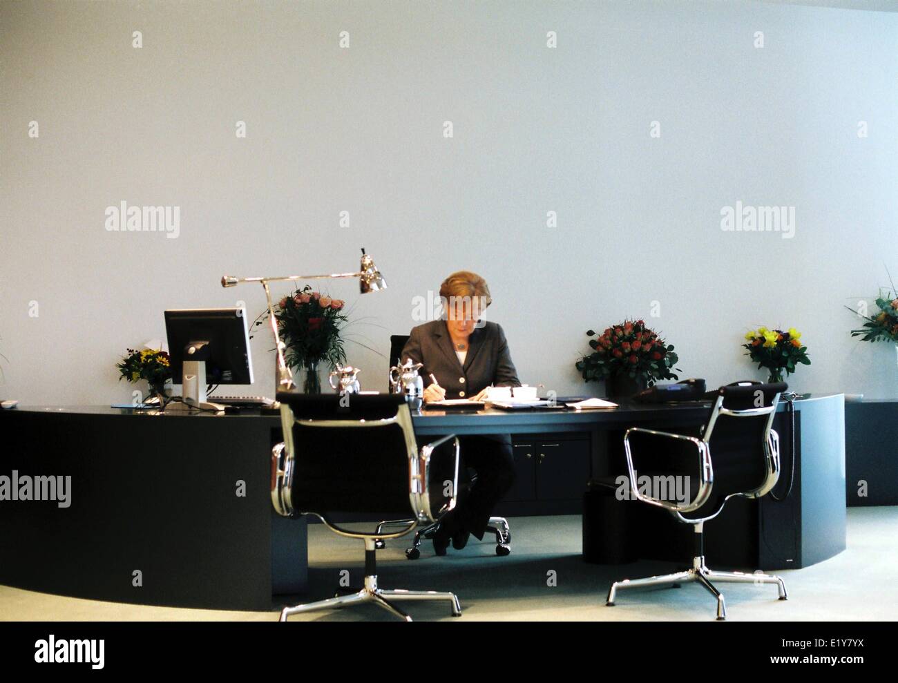 Chancellor Angela Merkel (CDU) sits at her desk in the Federal