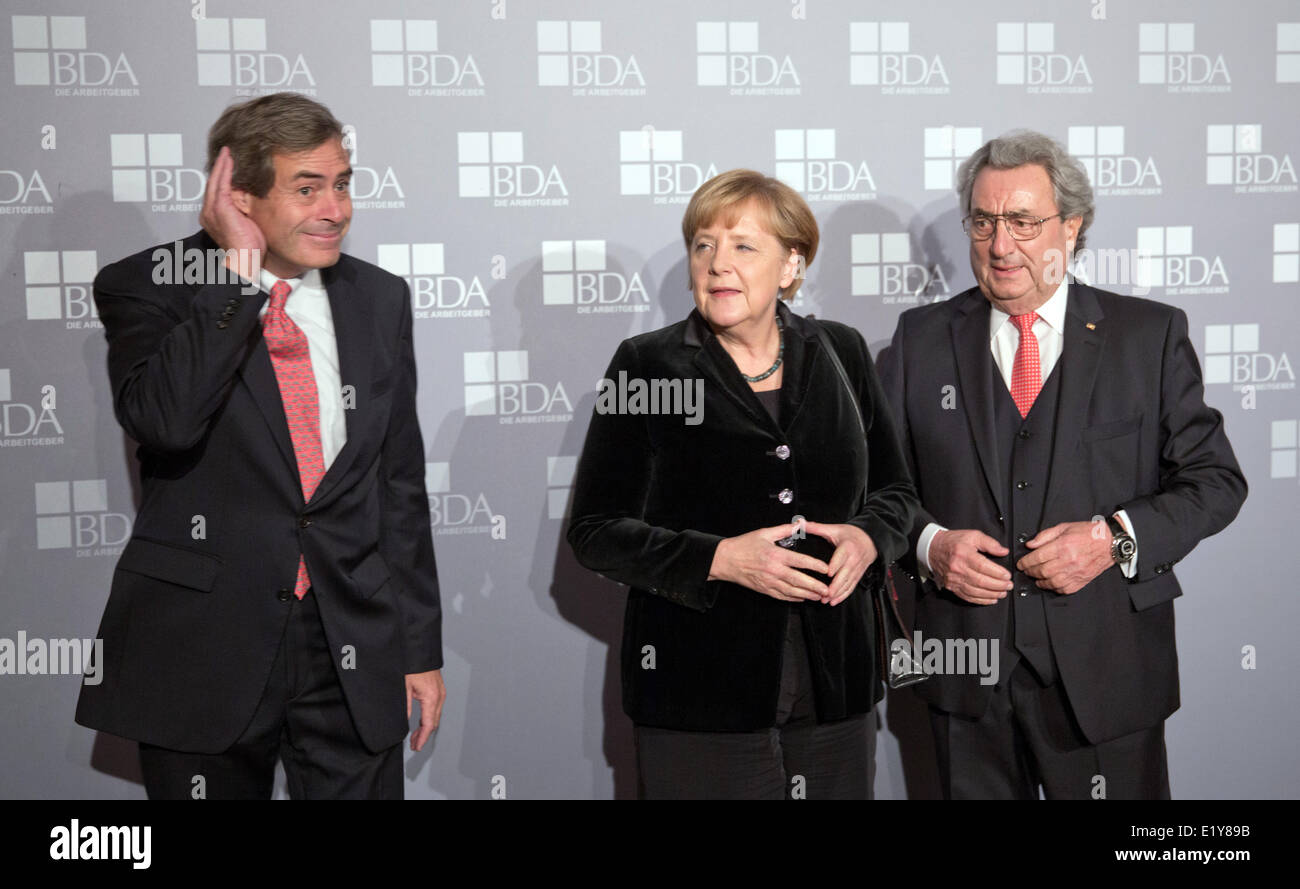 New president of the Employer Association Ingo Kramer, German chancellor Angela Merkel and former president of the Employer Association Dieter Hundt on the occasion of the election of the president of the Employer Association on the 18th of November in 2013 in Berlin. Stock Photo