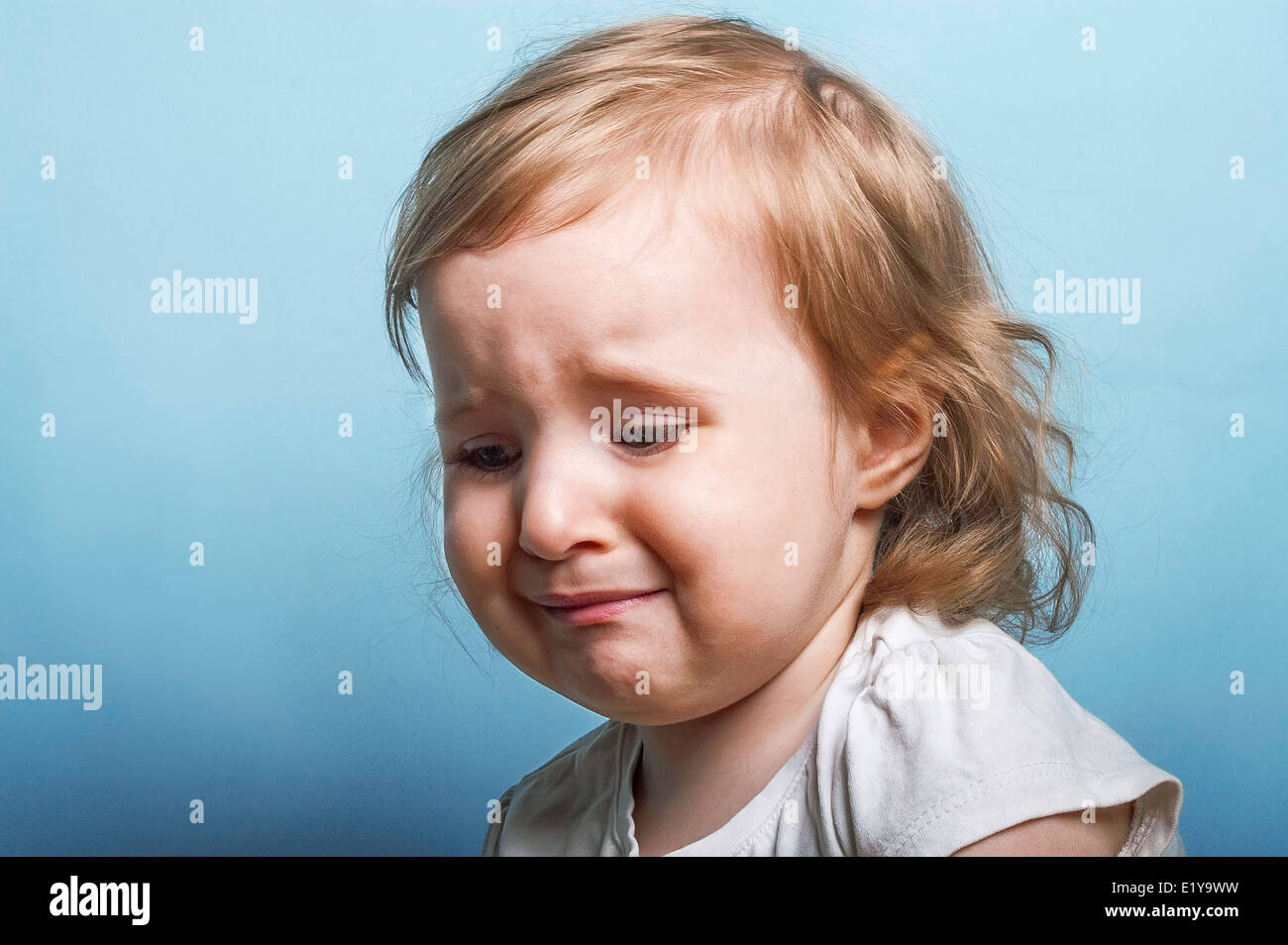 Emotional portrait of a two years old girl ready to burst to cry Stock