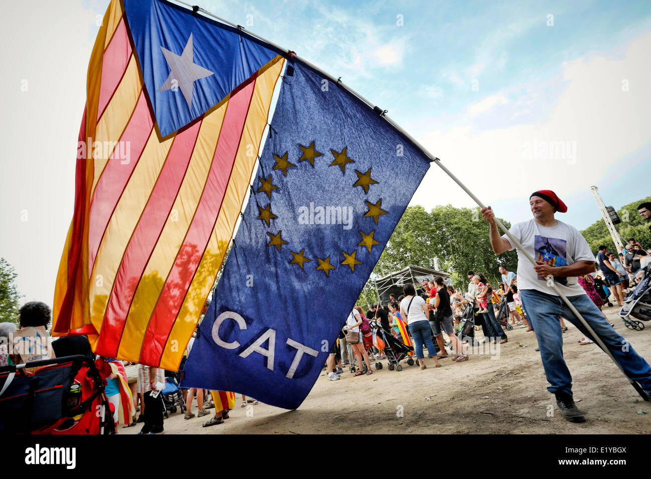 Man waving Catalan Independence Flags at a march for independence in Girona, Catalonia, Spain Stock Photo