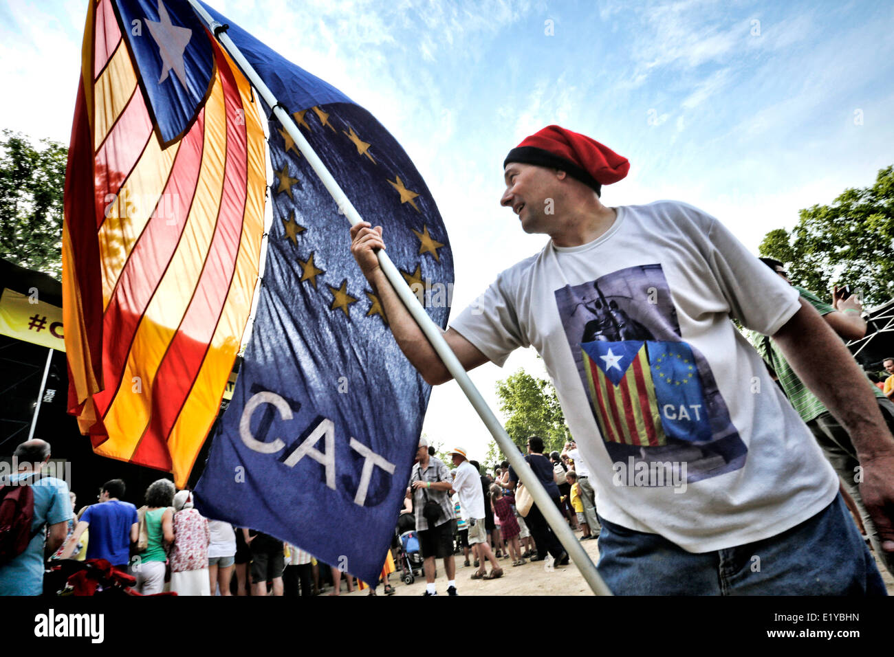 Man waving Catalan Independence Flags at a march for independence in Girona, Catalonia, Spain Stock Photo