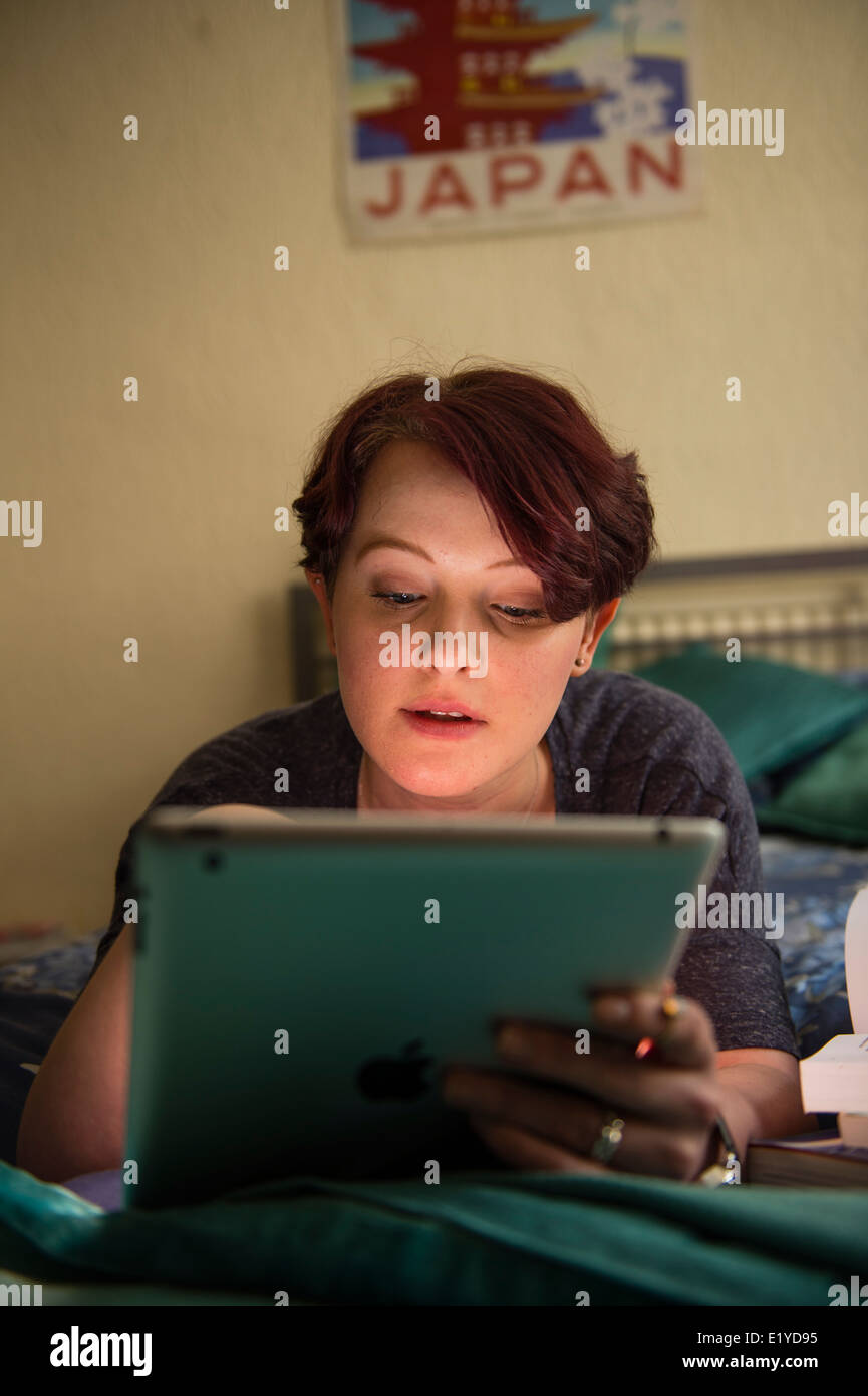 A young woman university college student working studying reading on