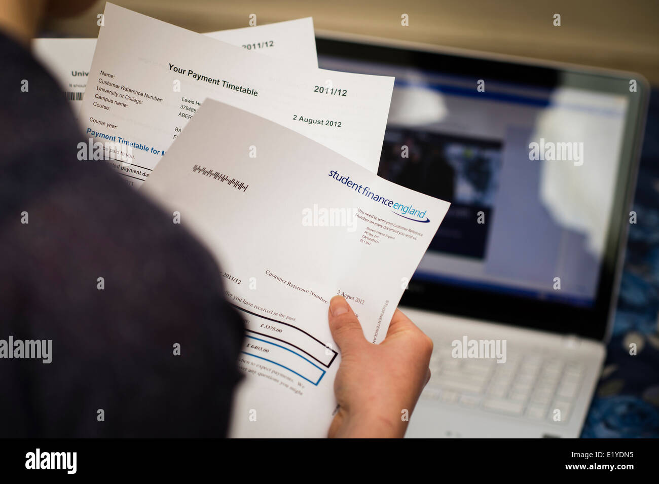 A student looking at Student Finance England - university education loan paperwork, UK Stock Photo