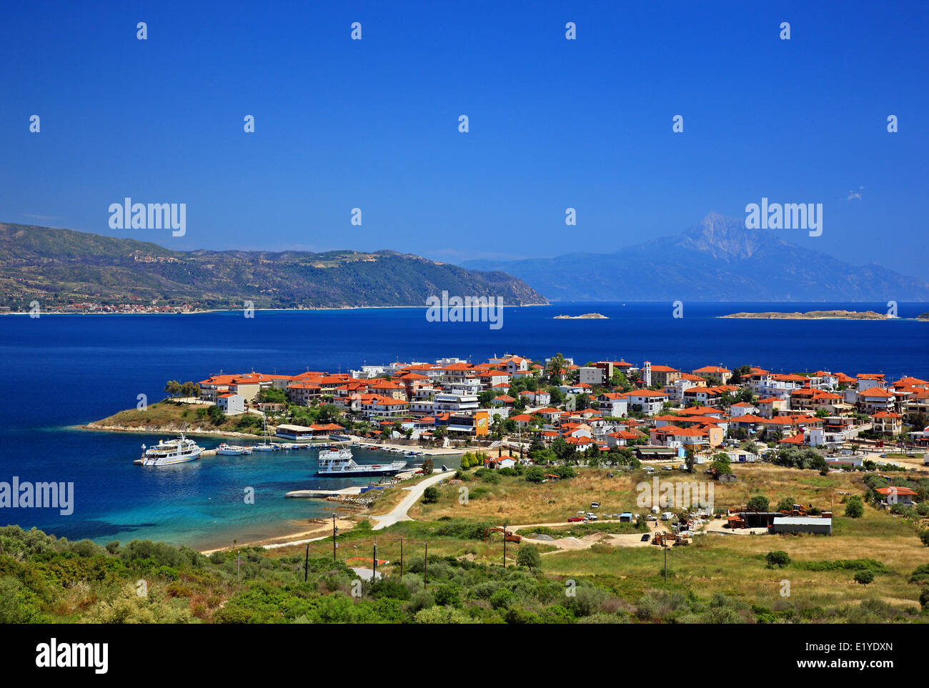 The village of Ammouliani island,  Halkidiki ('Chalkidiki'), Macedonia, Greece. In the background you can see Ouranoupolis. Stock Photo
