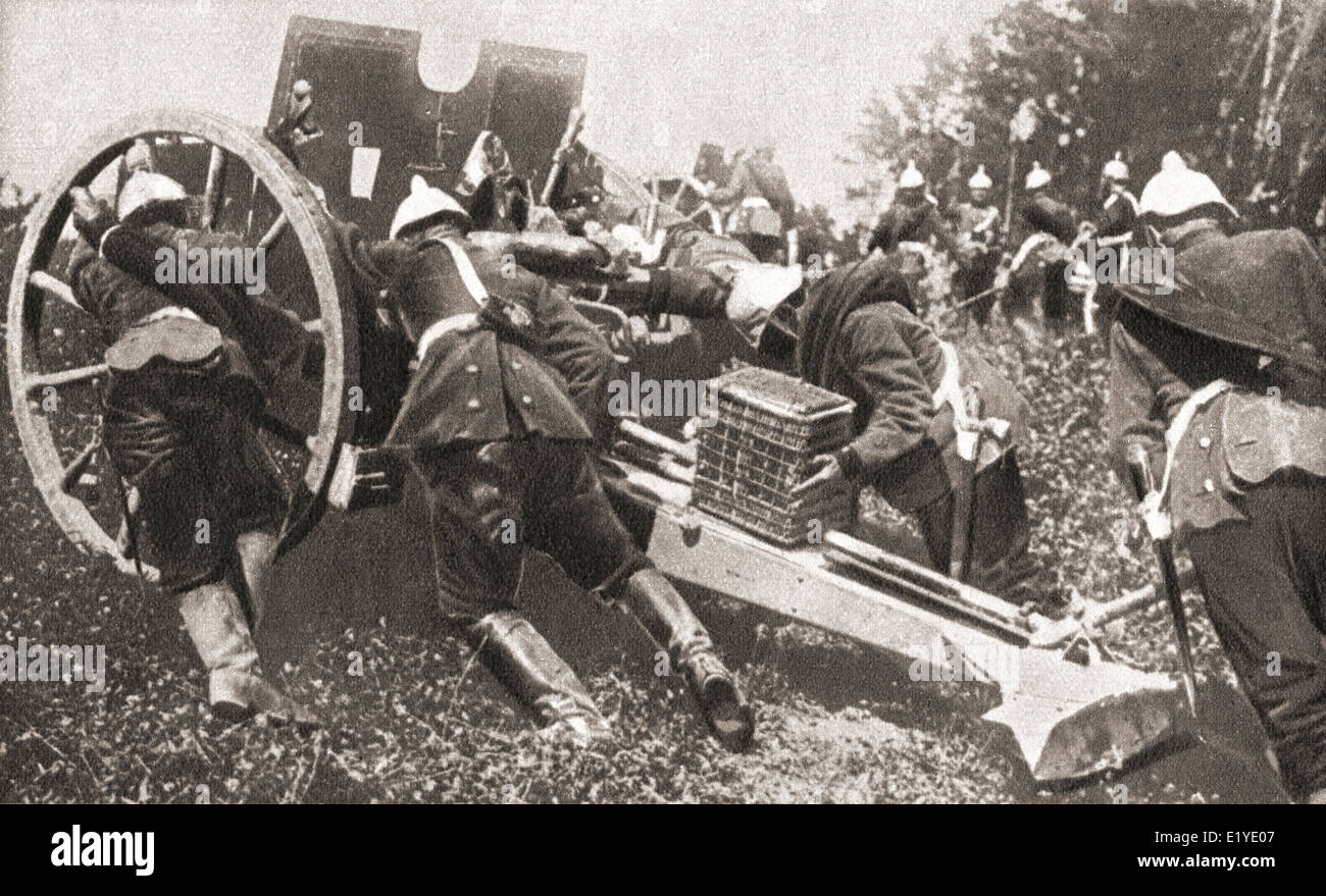 German artillery using man power to get their guns into position during WWI. Stock Photo