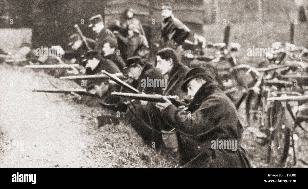 The famous motor cycle corps of Liège, Belgium defend a farm from the advancing Germans in 1914. Stock Photo