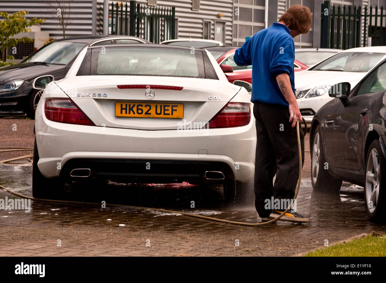 A New “Mercedes Benz SLK 250 CDi” car on being washed at the Kingsway West Mercedes-Benz Showroom in Dundee, UK Stock Photo