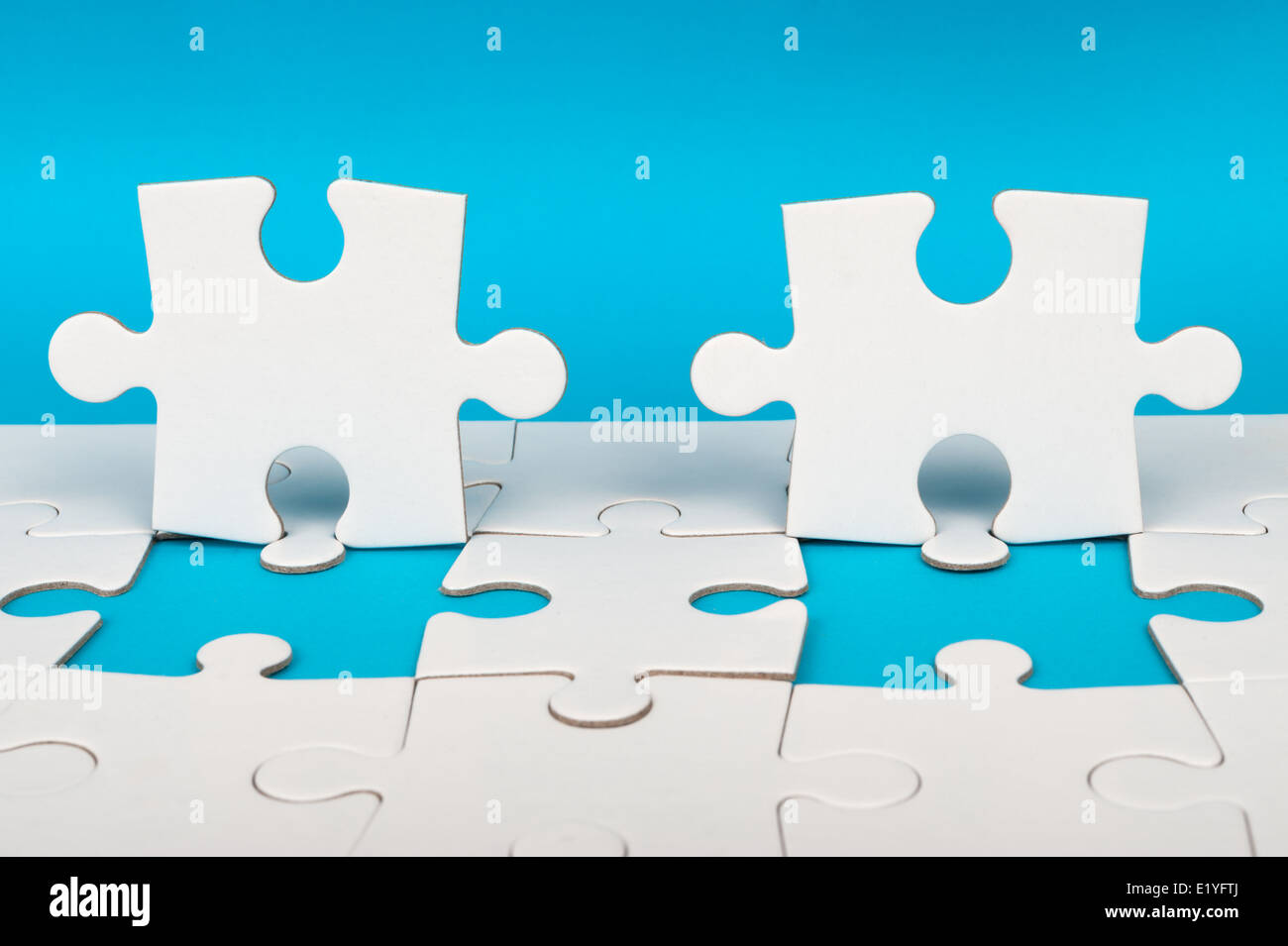 Group of white paper jigsaw puzzles Stock Photo
