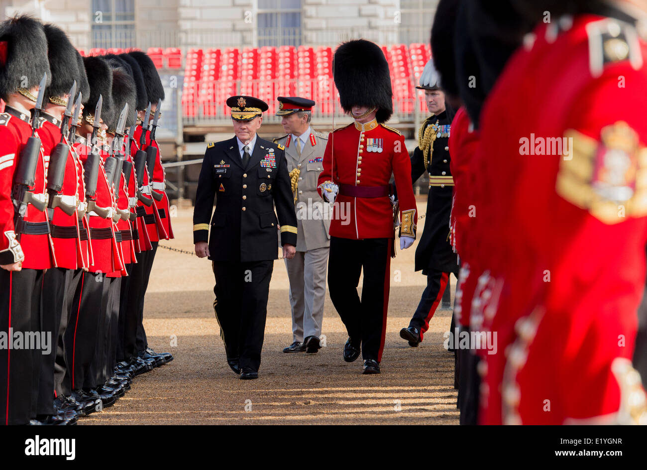 US Chairman of the Joint Chiefs Gen. Martin Dempsey, center left, inspects troops with U.K. Chief of Defense Staff for the British Armed Forces Gen. Sir Nickolas Houghton, center, during a Guard of Honor ceremony kicking off a Defense Chiefs Strategic Dialog June 10, 2014 in London, UK. Stock Photo