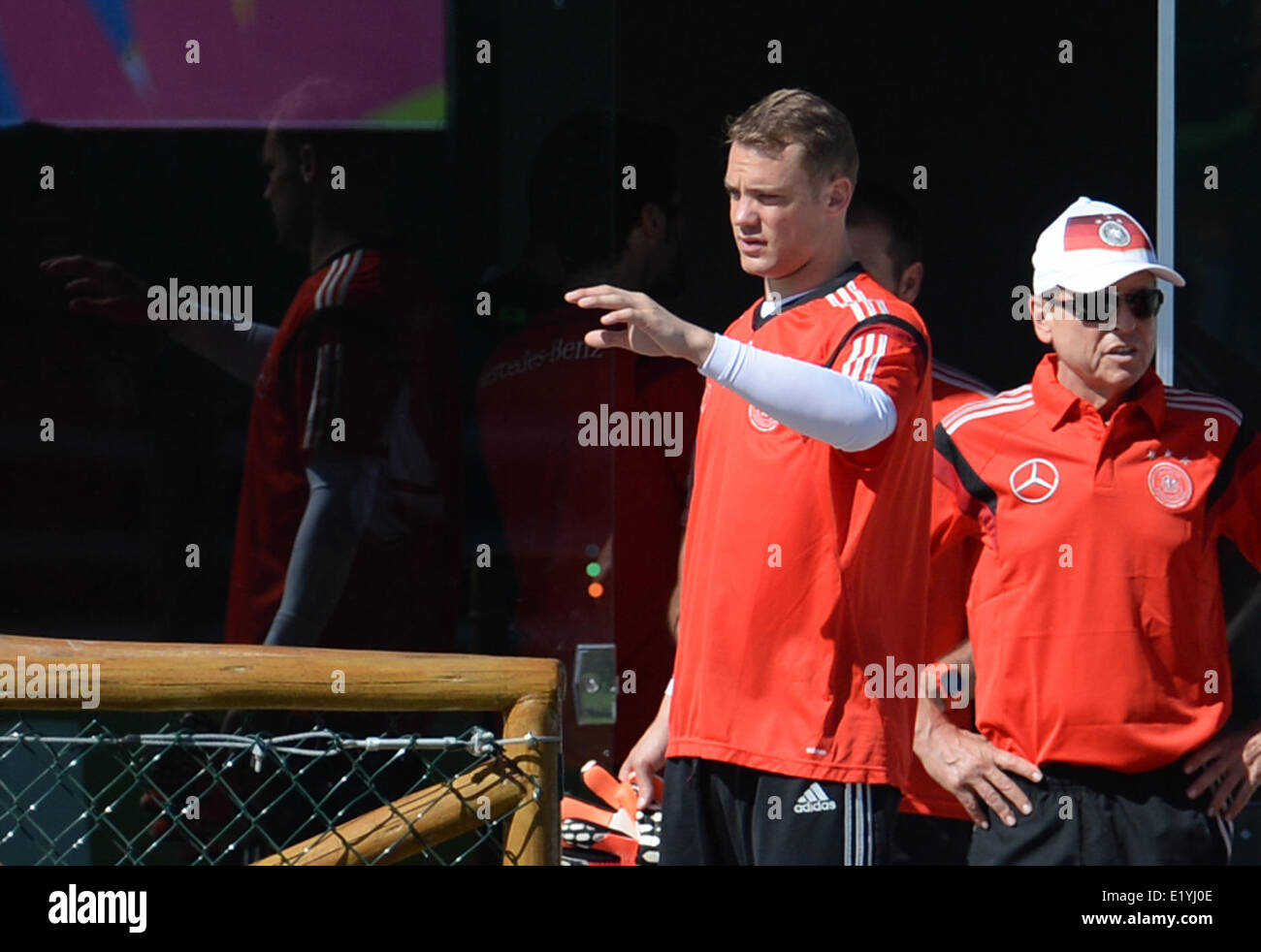 Goalkeeper Manuel Neuer (L) of the German national soccer team gestures during a training session in Santo Andre in Brazil, 11 June 2014. The FIFA World Cup 2014 will take place in Brazil from 12 June to 13 July 2014. Photo: Andreas Gebert/dpa Stock Photo