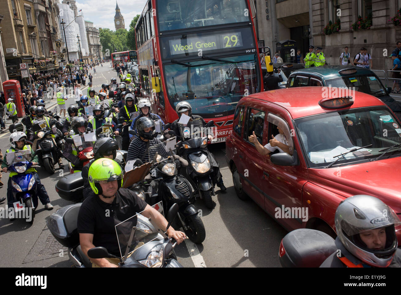 Black taxi cab drivers protest in Whitehall, central London, objecting to a new online booking and journey fare app called Uber. The app works out the cost of journeys and cab drivers say it is the same as using a taxi meter, which only black cabs are legally entitled to use. The London Taxi Driver Association (LTDA) also said part of the demonstration was about highlighting the length of training - between four and seven years - taxi drivers undergo before being licensed. During the protest roads were gridlocked around Parliament Square, Whitehall and Trafalgar Square in capital's West End. Stock Photo