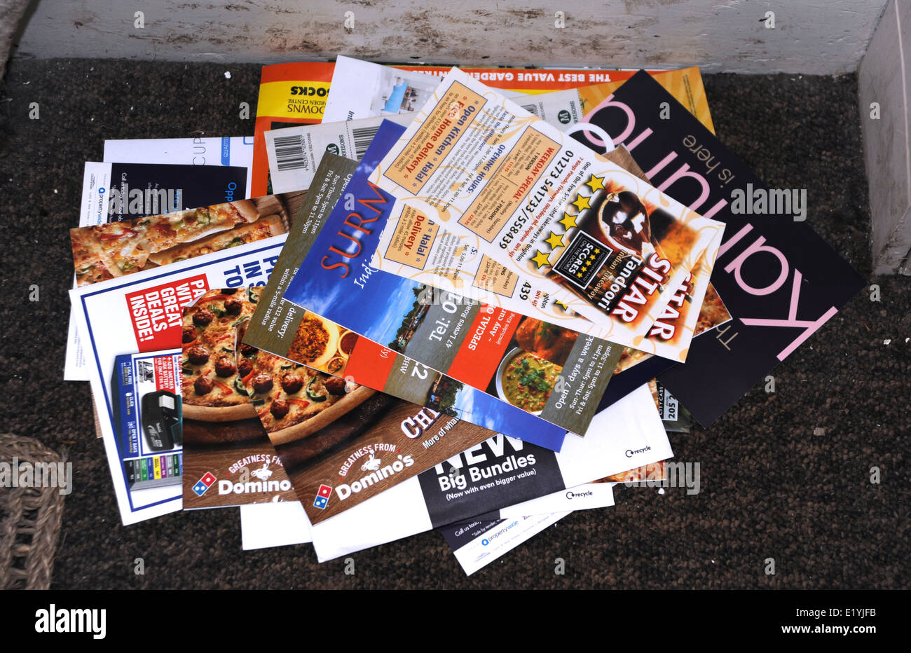 Junk mail left on a doormat in Brighton UK Stock Photo
