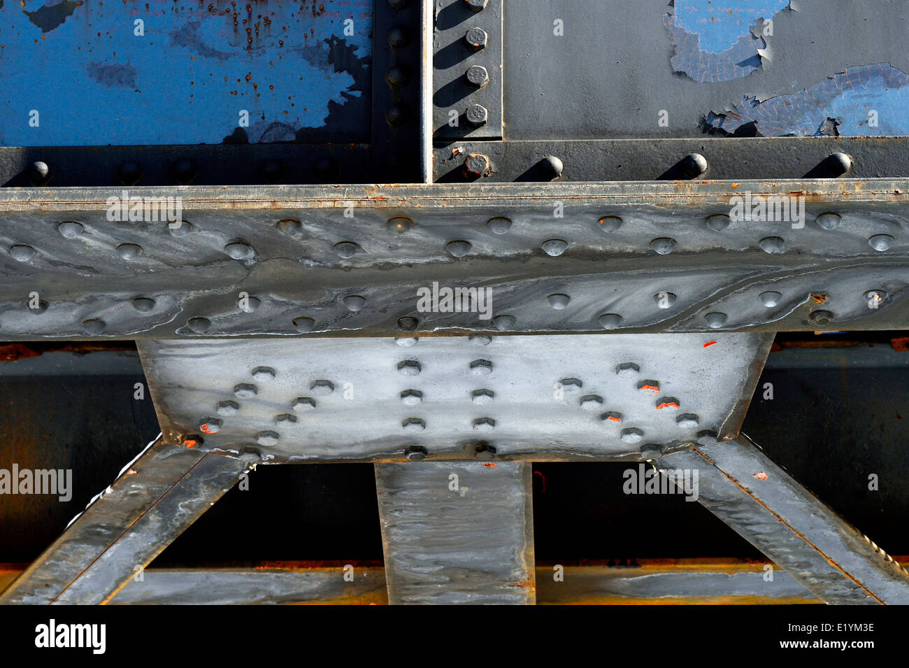 Steel girders bolted together to make the foundation of a train bridge Stock Photo
