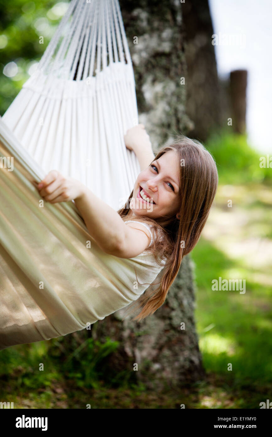 Young woman relaxing in hammock Stock Photo - Alamy