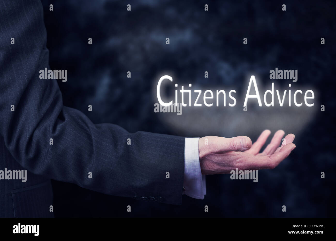 A businessmans hand holding the words, Citizens Advice. Stock Photo