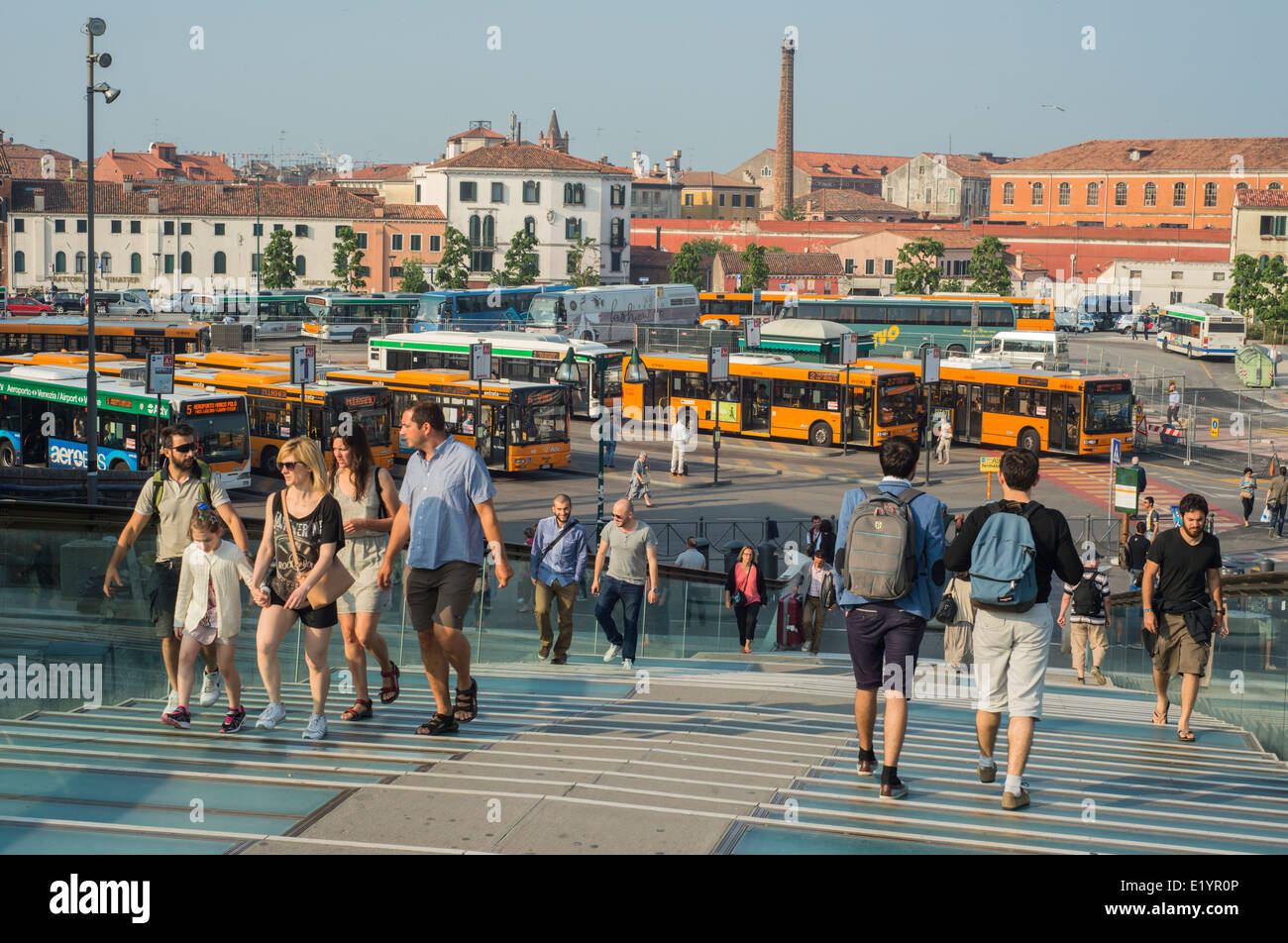 Tourists on Ponte della Costituzione aka Calatrava Bridge overlooking the main bus station at Piazzale Roma in Venice, Italy Stock Photo