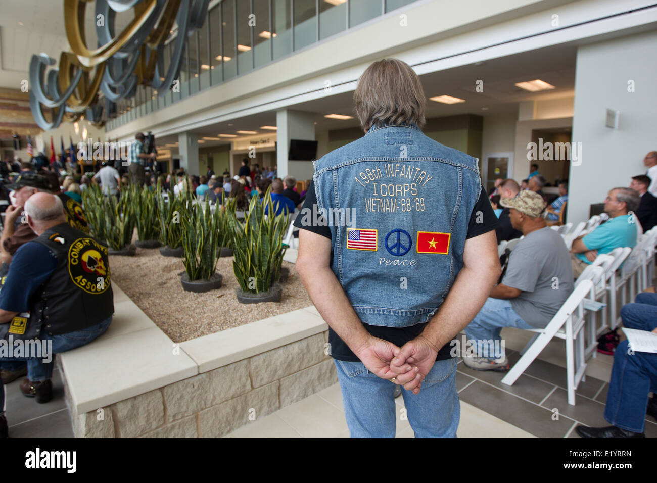 U.S. military veteran waits in the lobby area during grand opening of Veterans Administration outpatient clinic in Austin TX. Stock Photo