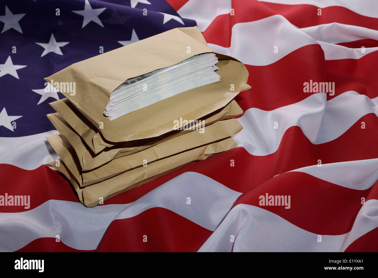 American flag with brown envelopes full of money Stock Photo
