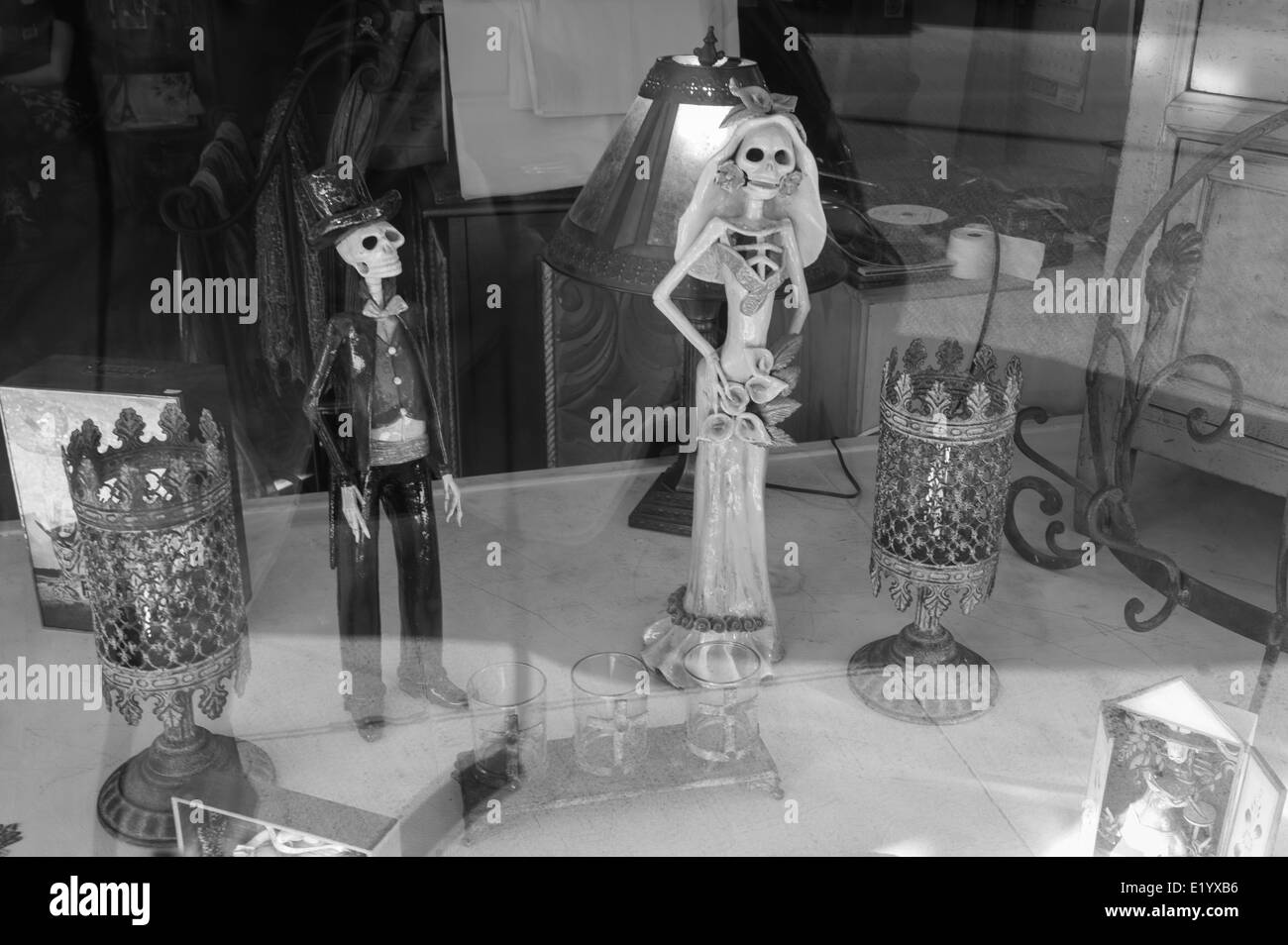 Skeleton Figurines in shop window. Stock Photo