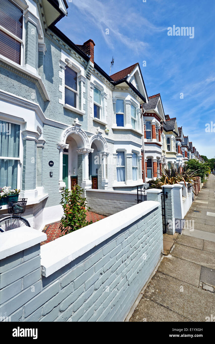 London street of early 20th century Edwardian terraced houses in a sunny day Stock Photo