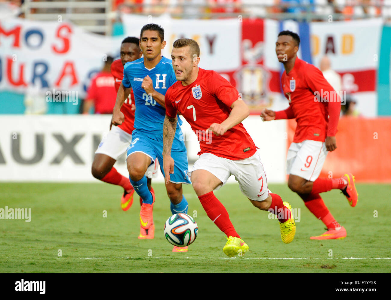 Florida, USA. 7th June, 2014. England Midfielder Jack Wilshere (7) controls the ball challenged by Honduras Midfielder Jorge Claros (20) and England Forward Daniel Sturridge (9) during an international friendly world cup warm up soccer match between England and Honduras at the Sun Life Stadium in Miami Gardens, Florida. © Action Plus Sports/Alamy Live News Stock Photo