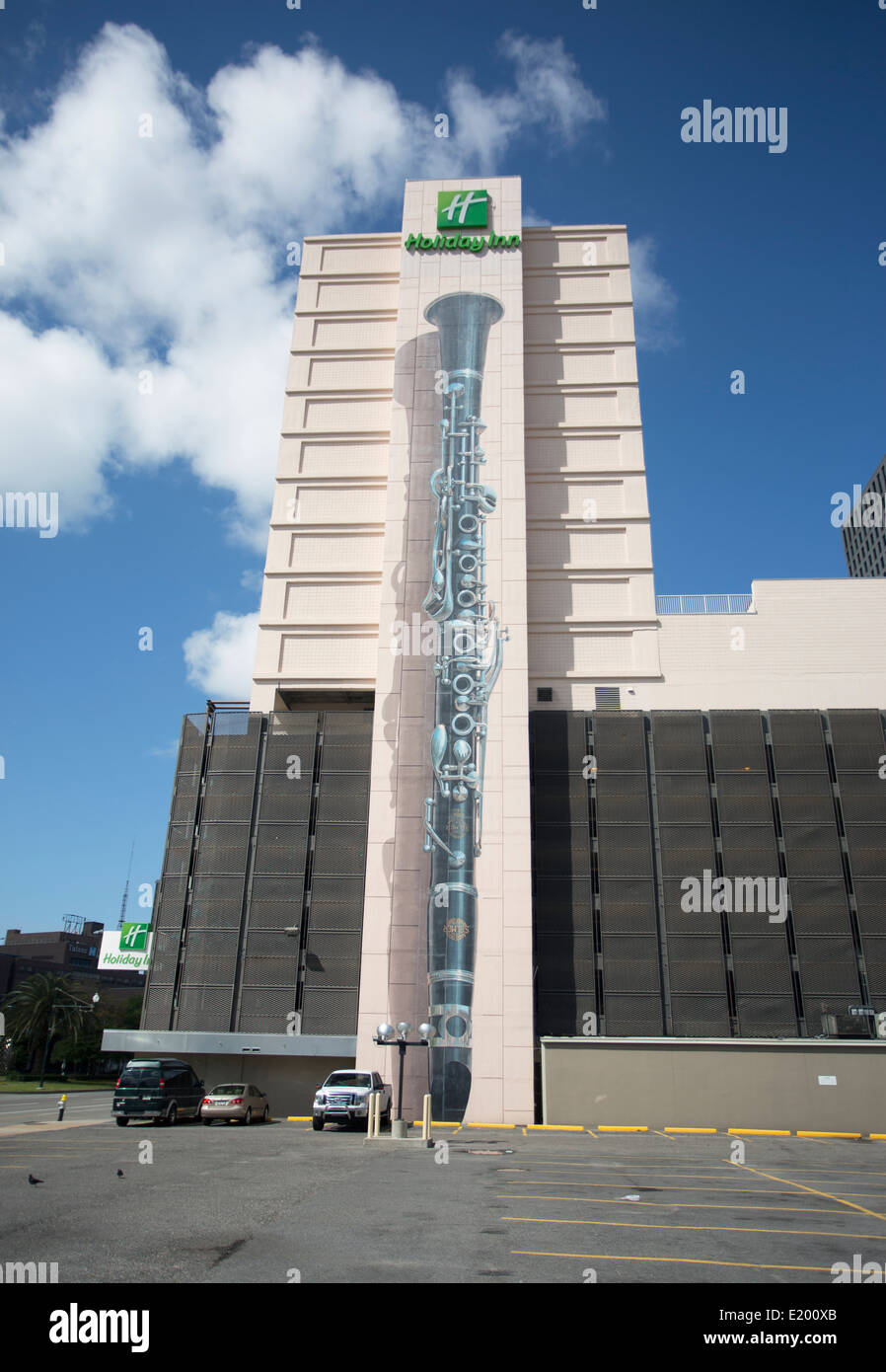 A large mural of a clarinet painted on the side of a Holiday Inn in New Orleans. Stock Photo