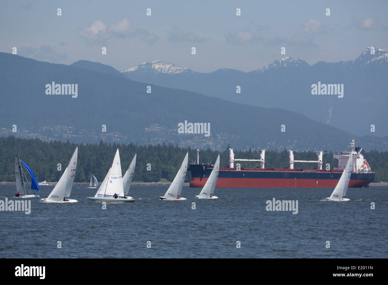 Sailboats and a tanker ship are seen from Jericho Beach, Vancouver, British Columbia. Stock Photo