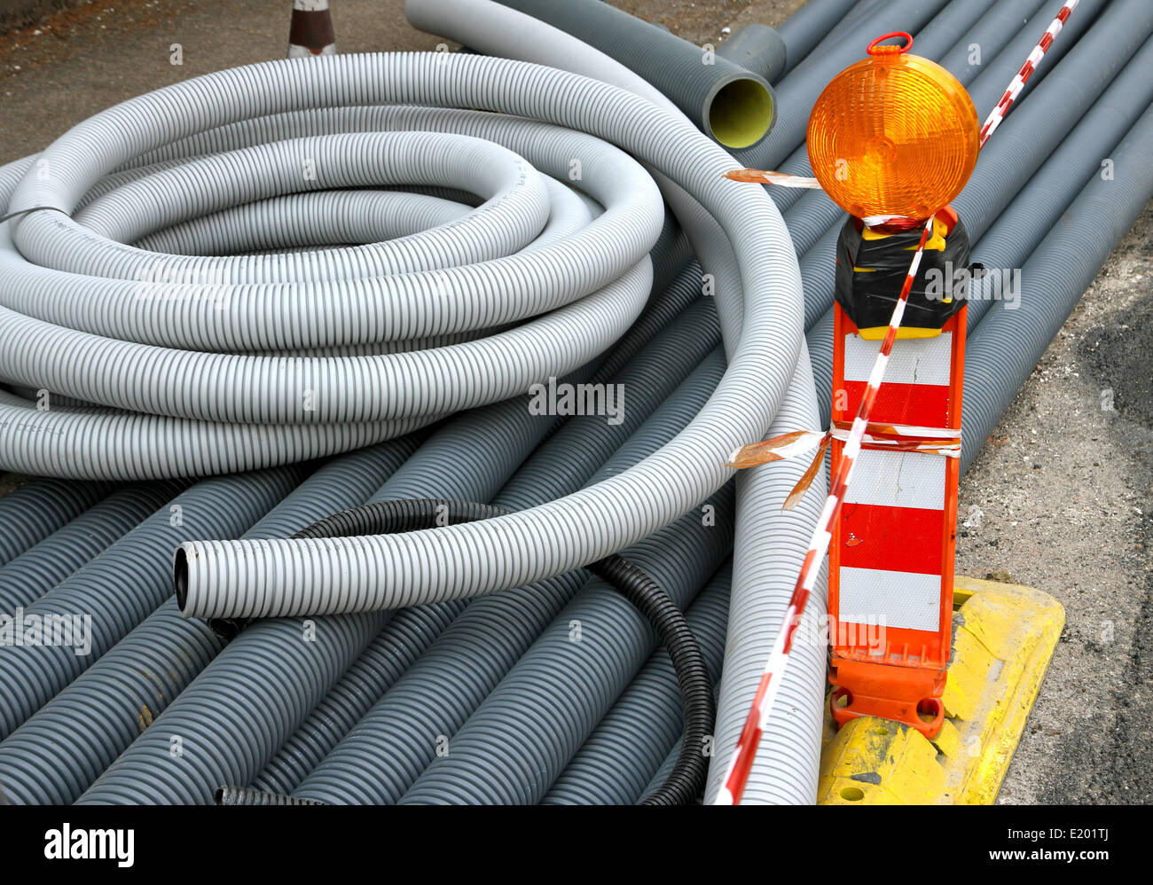signal light and grey plastic pipes for laying optical fiber in the
