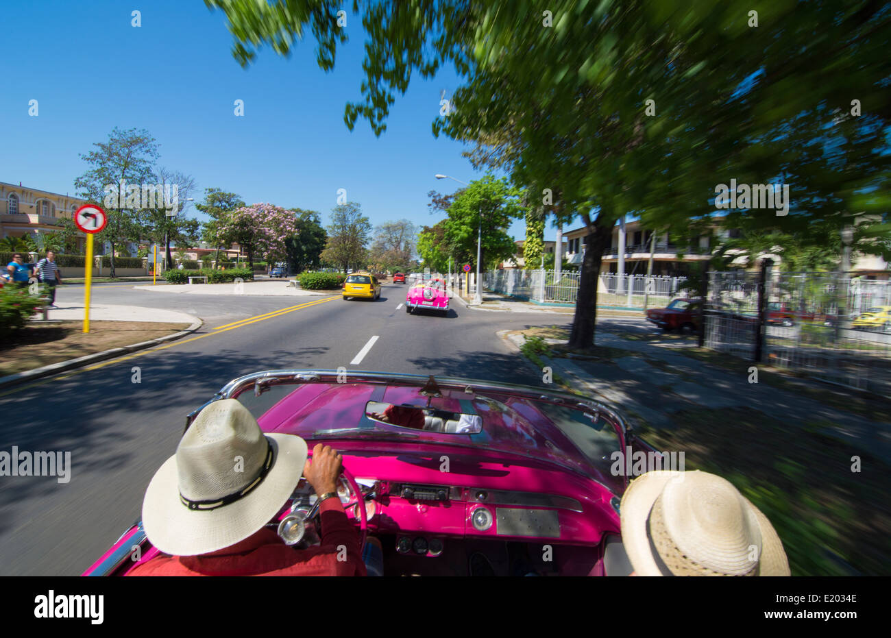 Havana Cuba driving in classic 1950s convertible around Havana streets with tourists 9 Stock Photo