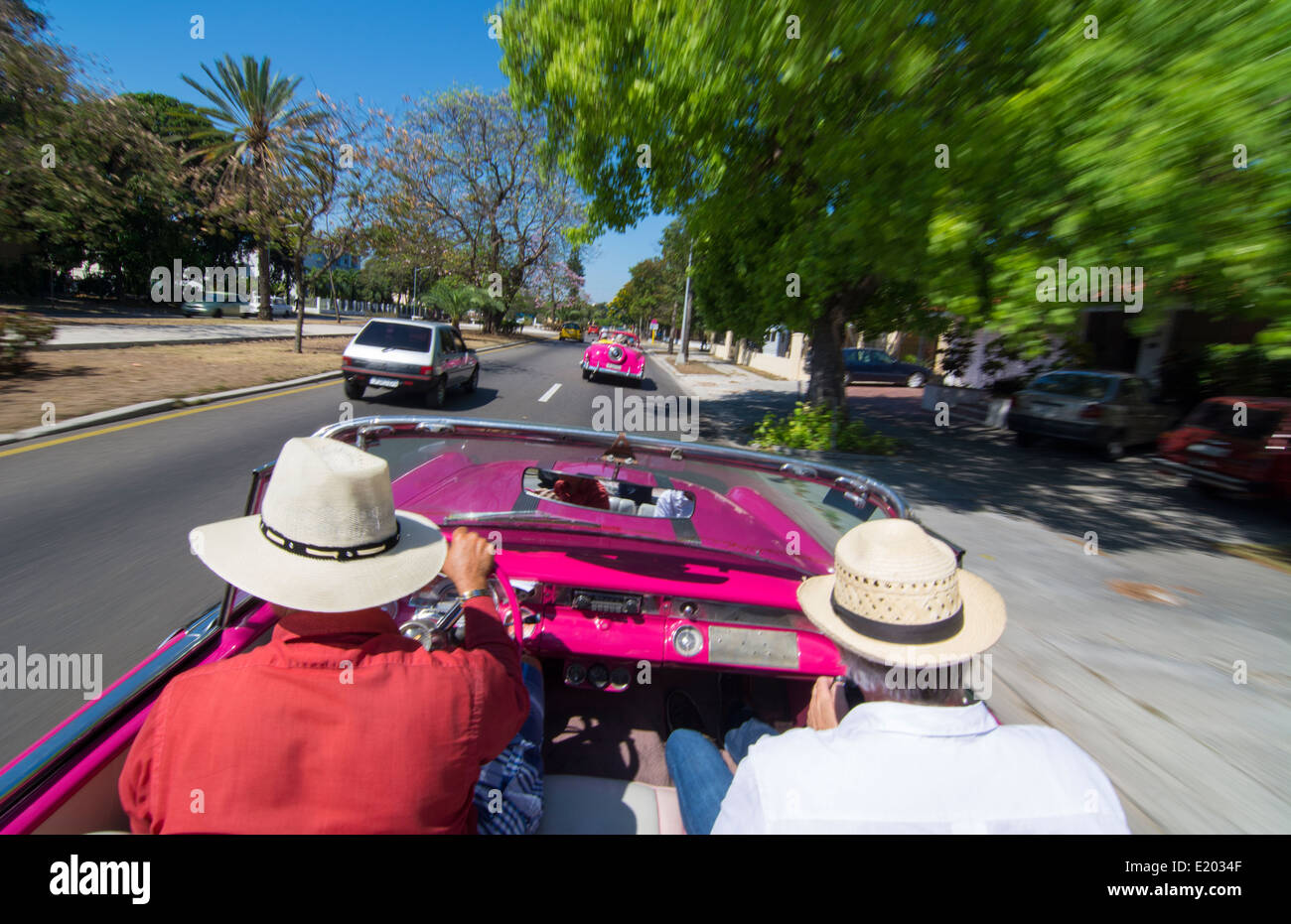 Havana Cuba driving in classic 1950s convertible around Havana streets with tourists 9 Stock Photo