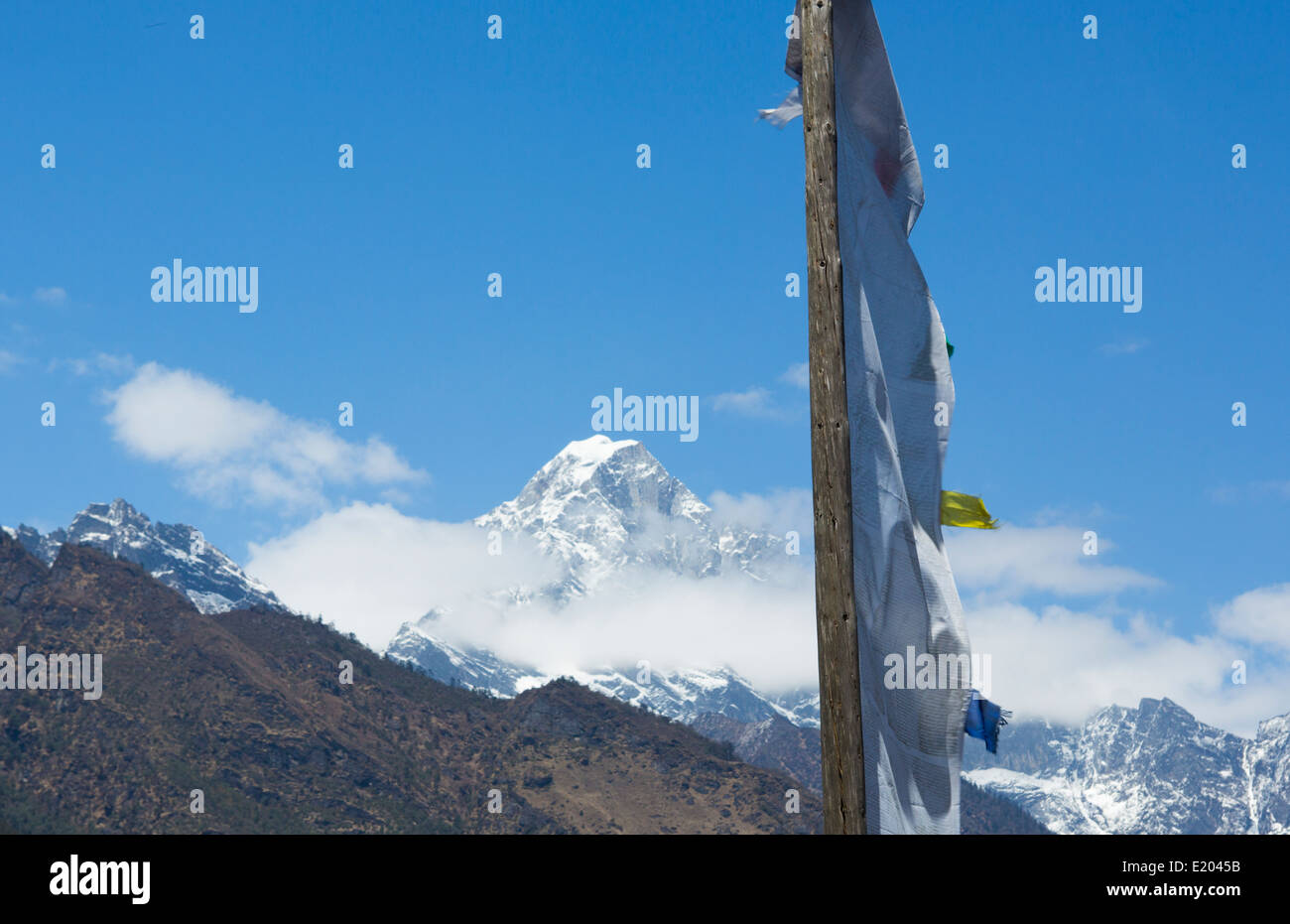 Nepal Prayer flag with the Himalayas in the background Solukhumbu Stock Photo
