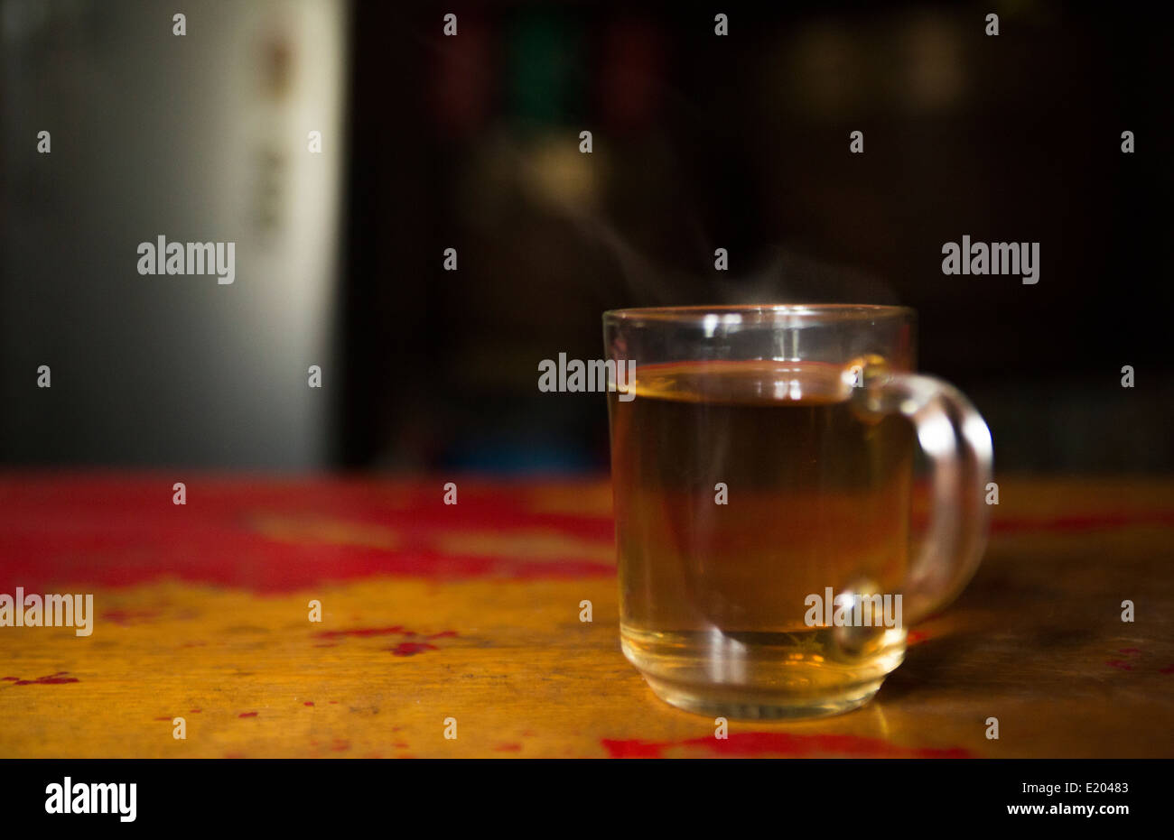 Nepal Himalayas cup of tea sitting on a table in a teahouse in the village of Tok Tok, Solukhumbu remote near Mt Everest. Stock Photo