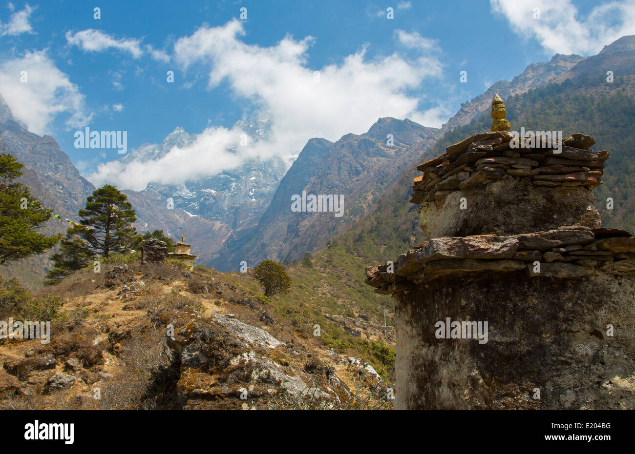 Nepal valley reaching back into the Himalayas with a Chortin in the foreground Stock Photo