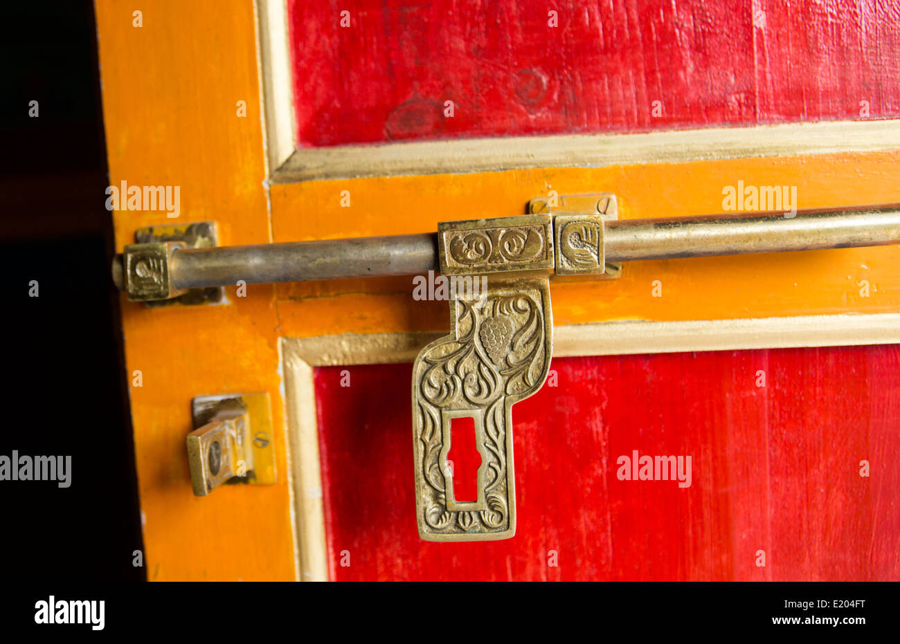 Nepal The ornate latch to the door of a shrine and prayer-wheel in Khumbjung Solukhumbu, remote, Mt Everest, Himalayas Stock Photo