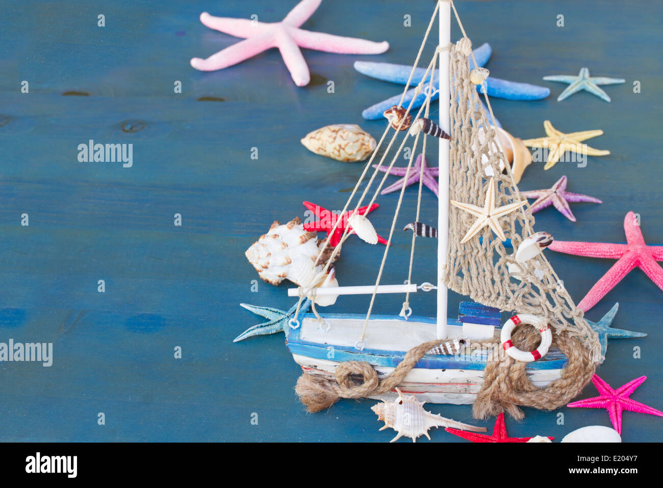 Seashells, starfish and boat with copy space Stock Photo - Alamy