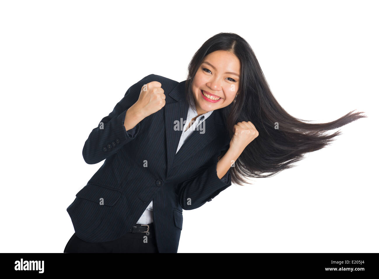 asian business woman celebrating success with hair swinging Stock Photo