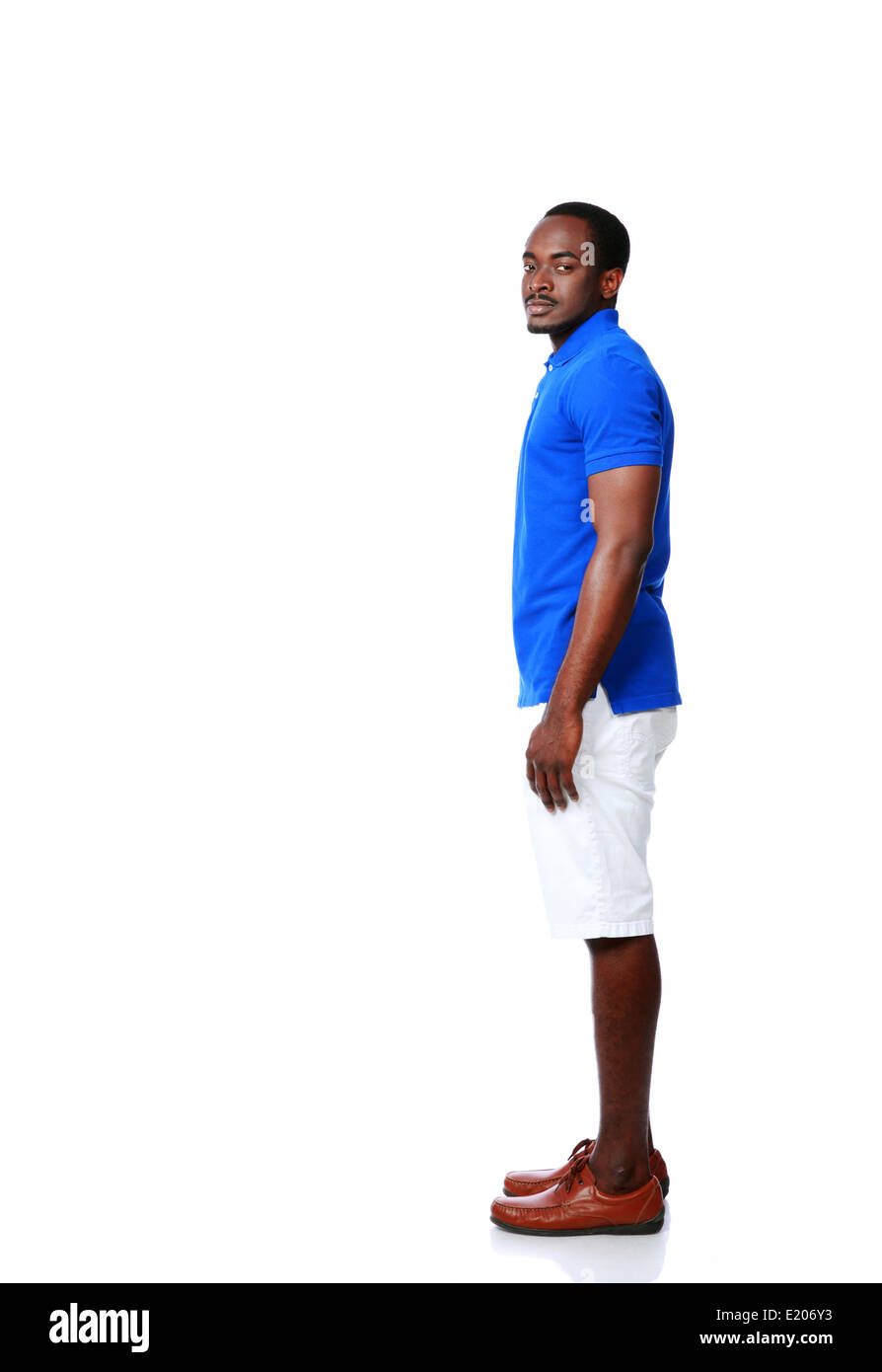 Side view portrait of african man standing over white background