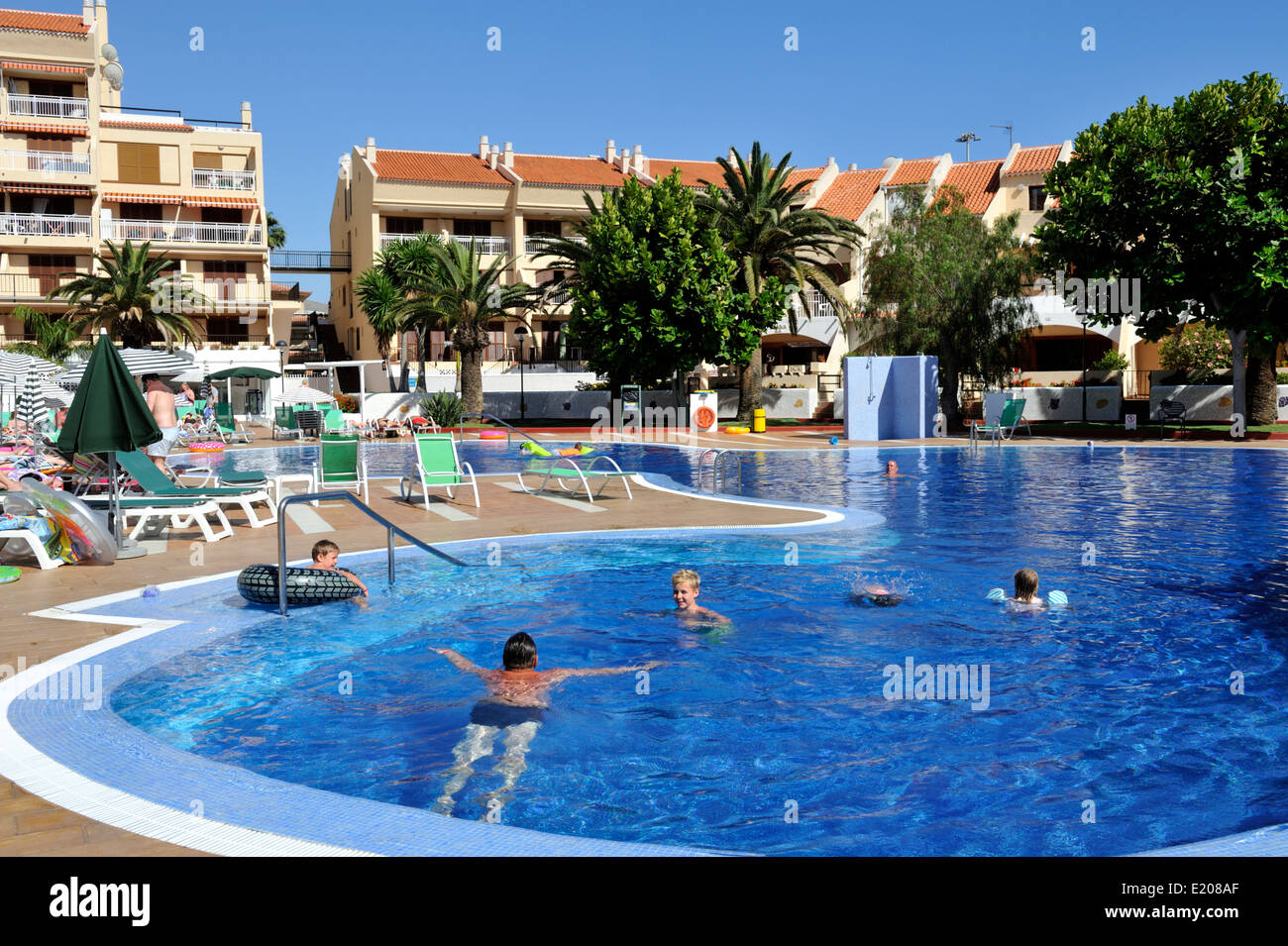 Holiday apartment pool and building in Playa de Las Americas Tenerife,  Spain Stock Photo - Alamy