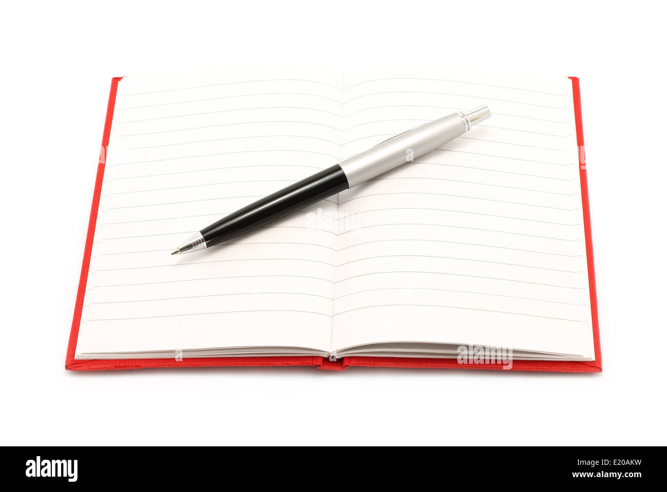 Notepad with ball pen on a white background Stock Photo - Alamy