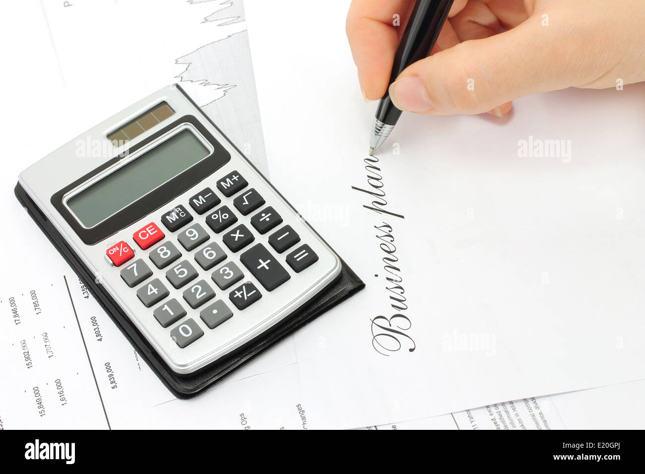 Writing woman hand on a white background Stock Photo - Alamy