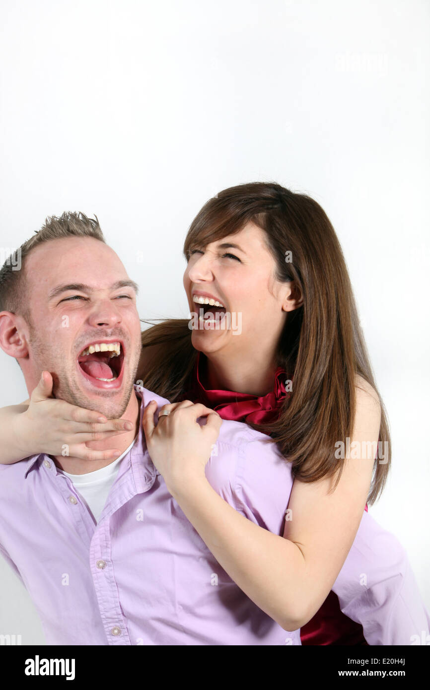 Young happy couple laughs total Stock Photo