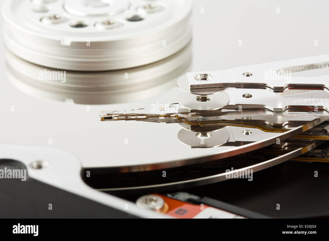 Platters and head of a computer hard drive Stock Photo
