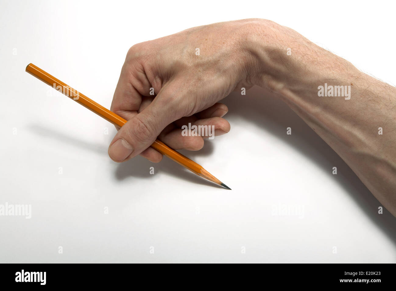 Using Pencil Hand Hand holding a pencil Stock Photo - Alamy