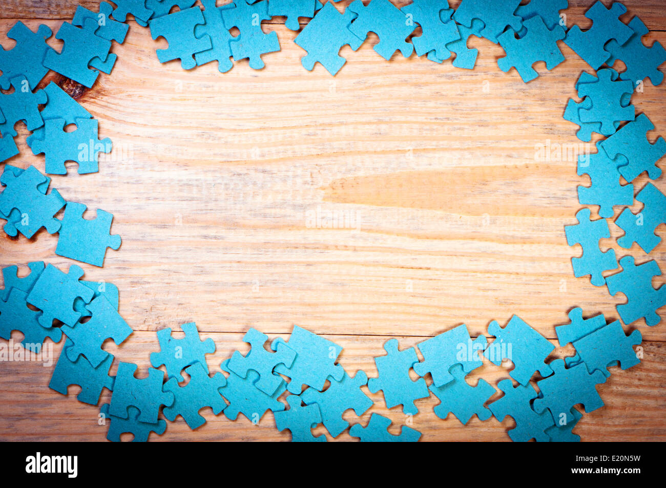 Wood background with puzzles Stock Photo - Alamy