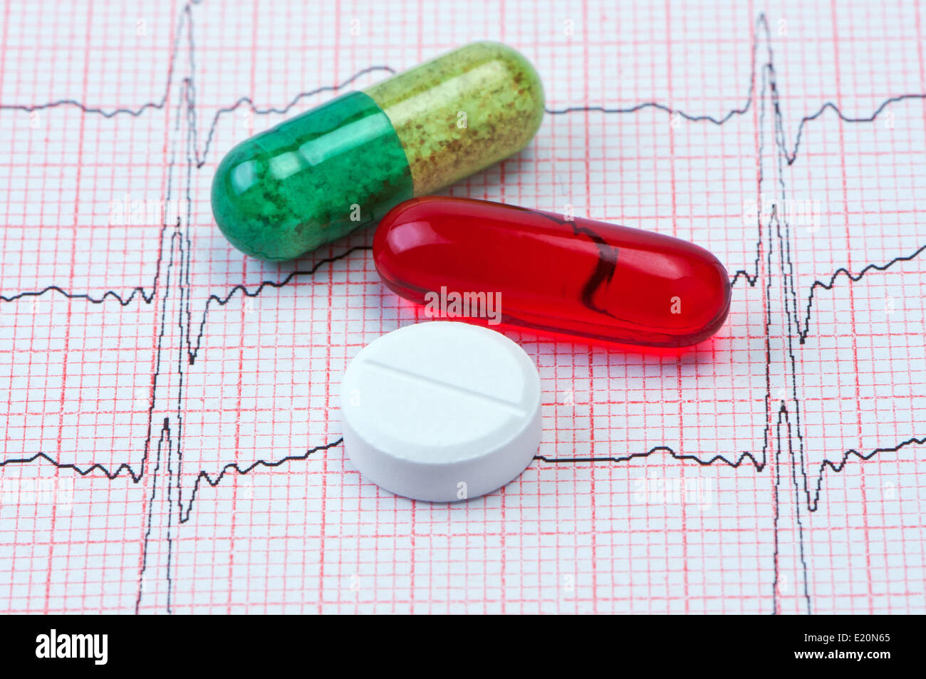 Tablets and capsules for cardiogram heart. Stock Photo
